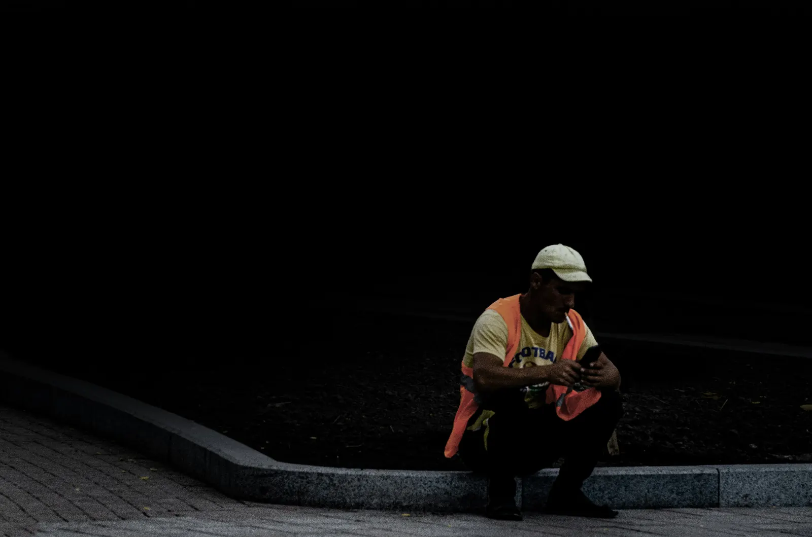 Connecticut contractor checking incoming leads on phone at a Hartford County CT jobsite